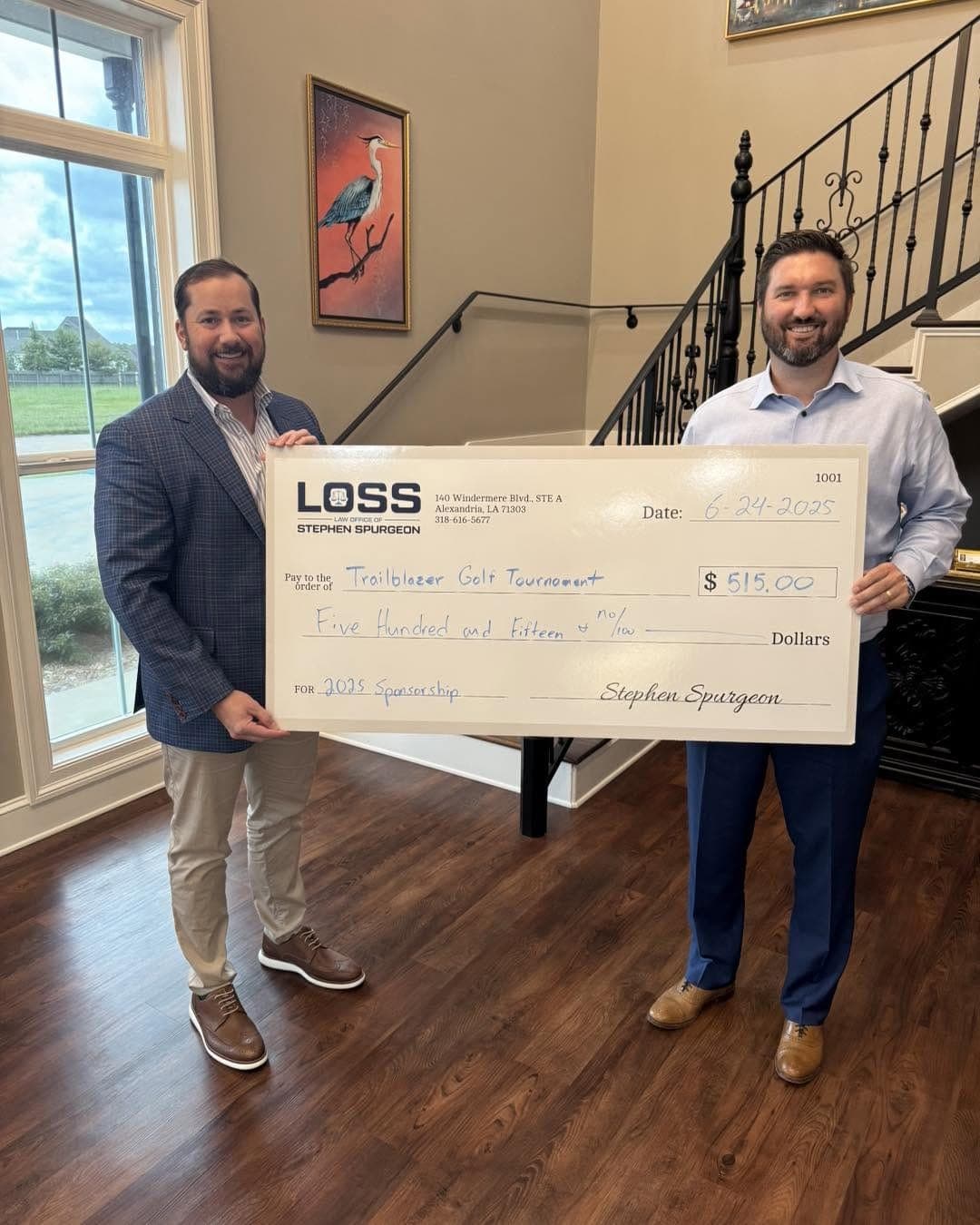Stephen Spurgeon presenting the firm's 2025 sponsorship check to the Trailblazer Golf Tournament